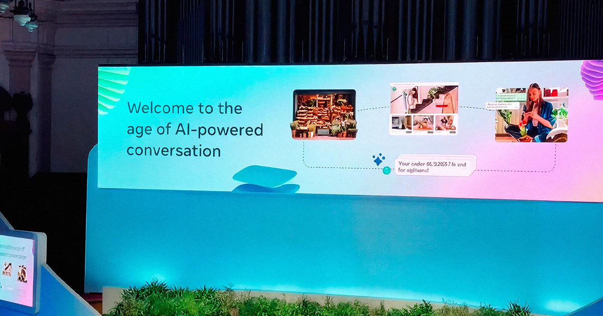 Telão do Conversations 2026 da Meta em Londres com a frase Welcome to the age of AI-powered conversation